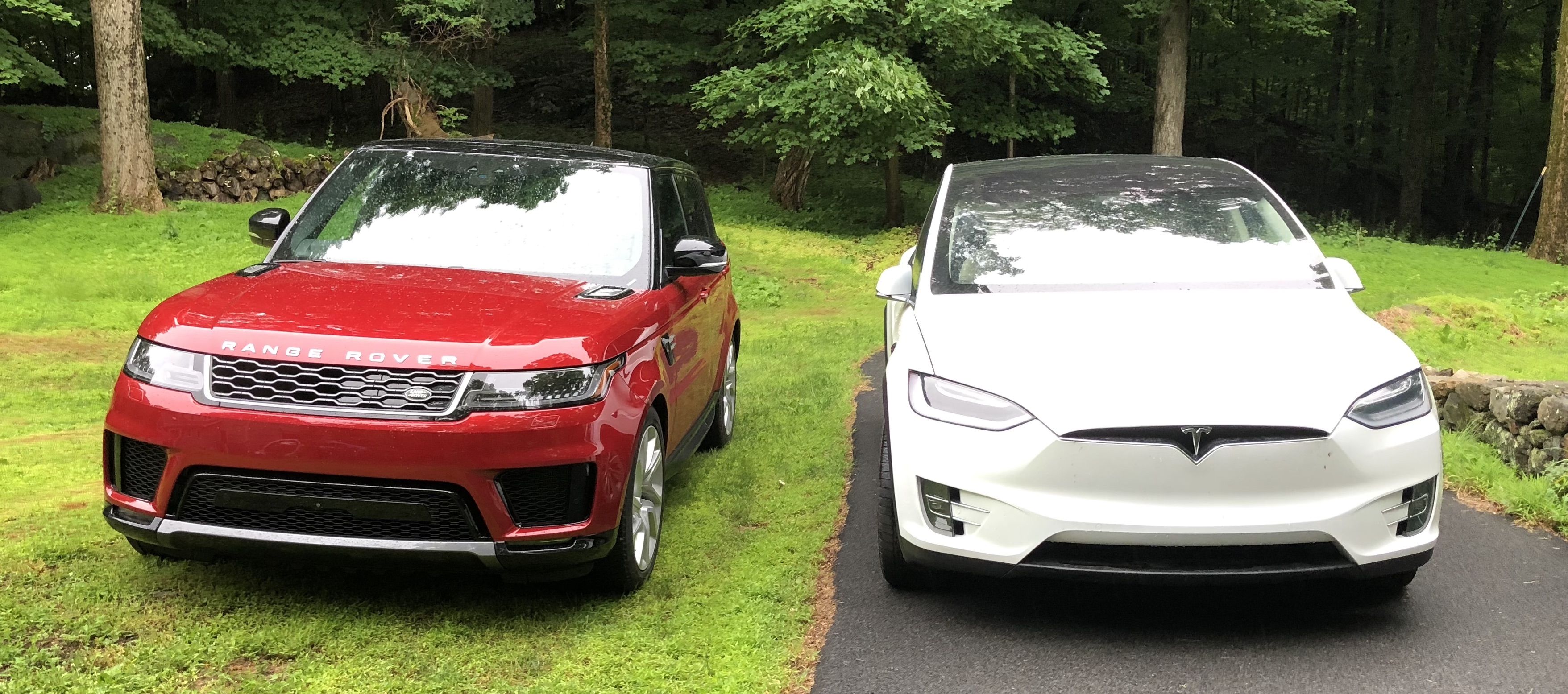 Range Rover Sport PHEV next to Tesla Model X