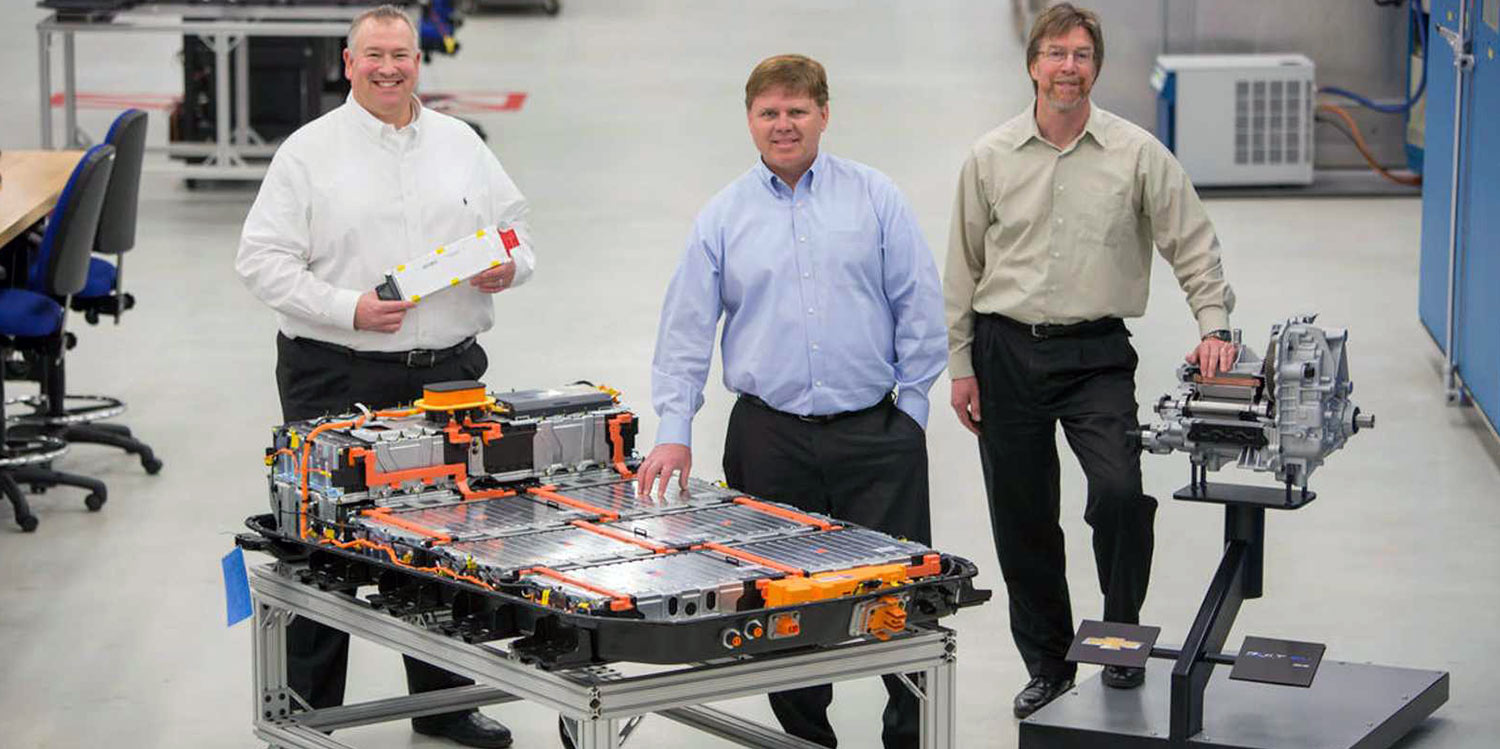 Tim Grewe, center, with colleagues working on the Bolt EV battery pack