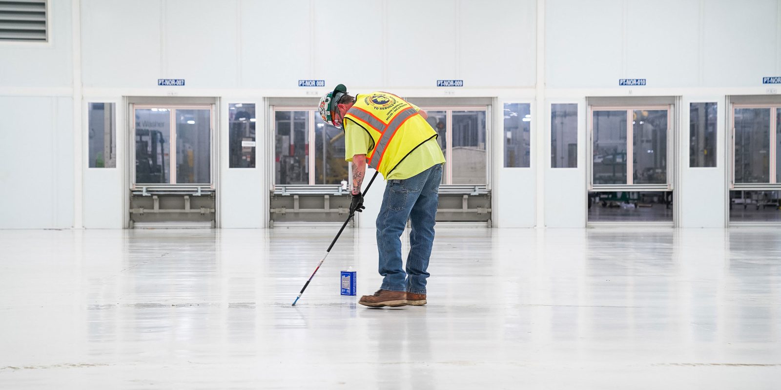 A worker prepares a cleanroom to produce surgical masks at GM’s Warren, Michigan manufacturing facility.