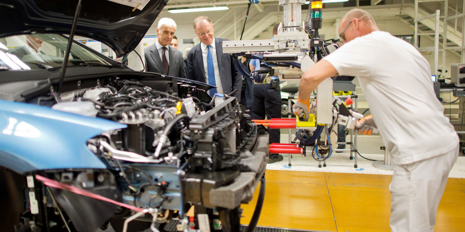 Former VW CEO Matthias Müller (left) and Stephan Weil, premier of Lower Saxony, tour a VW factory in 2017